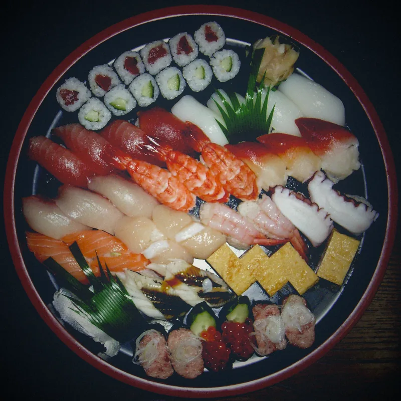 A round platter of assorted sushi